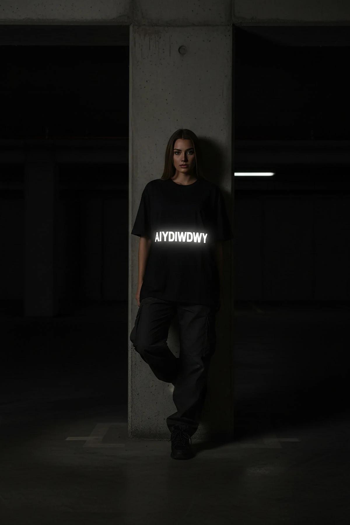 full-length view of black boxy oversized t-shirt with dropped shoulder seam and extended back hem