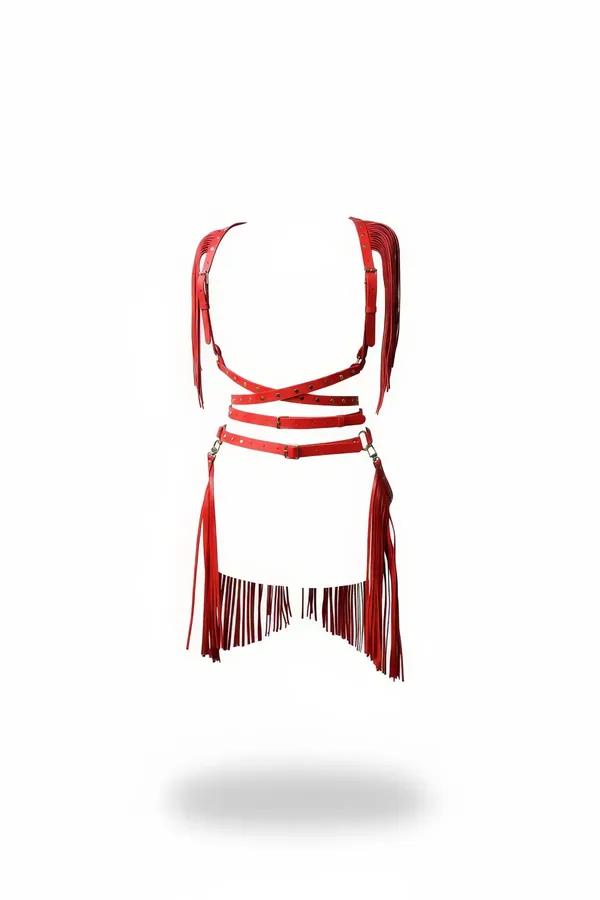 Red faux leather full body harness and waist cinch set with cascading fringe panels and silver O-ring hardware on white backg