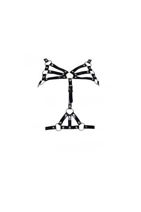 black faux leather cage harness bra with fan-splayed straps and five silver studded O-rings on white background