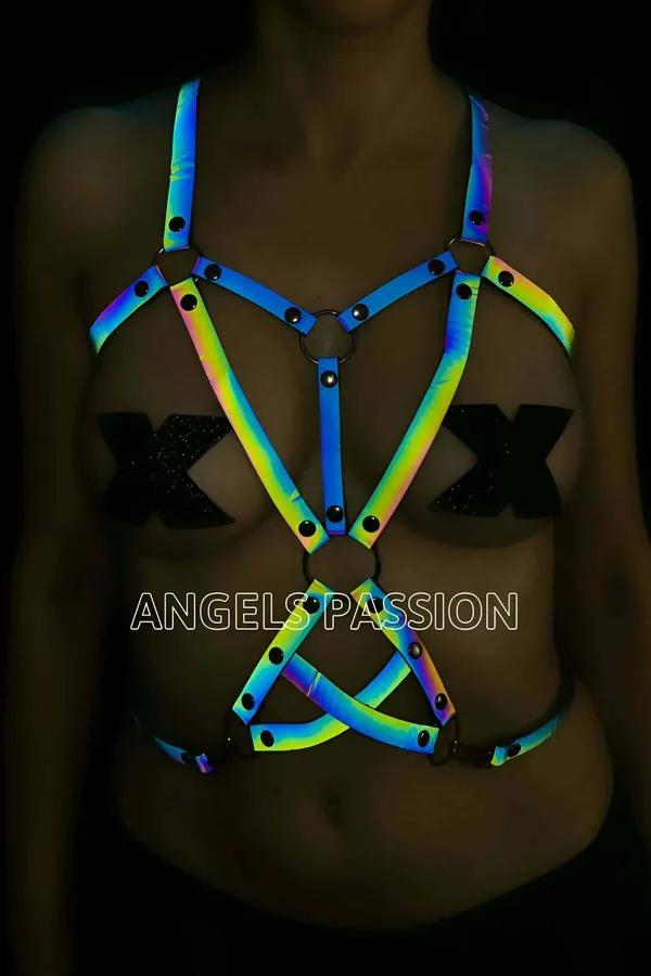 Reflective rainbow body harness with iridescent blue green yellow straps and black O-ring hardware geometric cage design