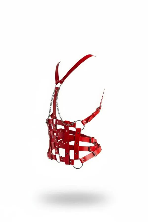 red faux leather caged torso harness with silver chain, O-rings, and Y-shoulder straps on white background