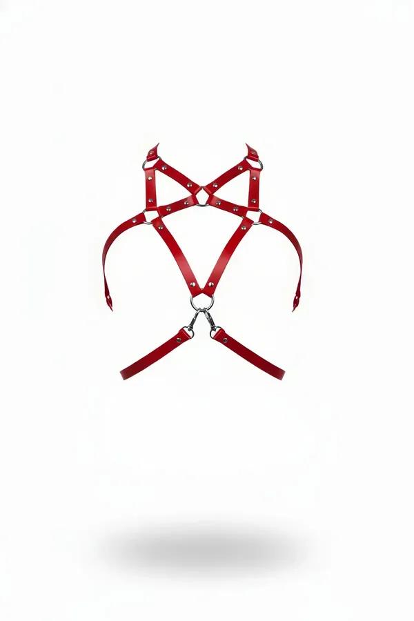 Red faux leather chest harness with silver O-ring centerpiece, studded straps, and spring clasps on white background
