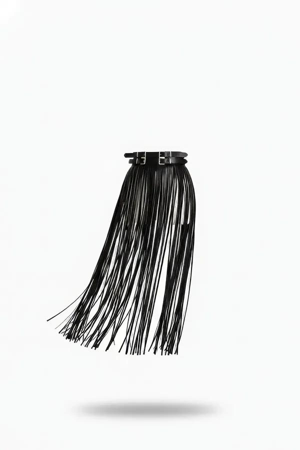 Black faux leather tassel fringe skirt with double silver buckle waistband, long fringe strands cascading from structured wai