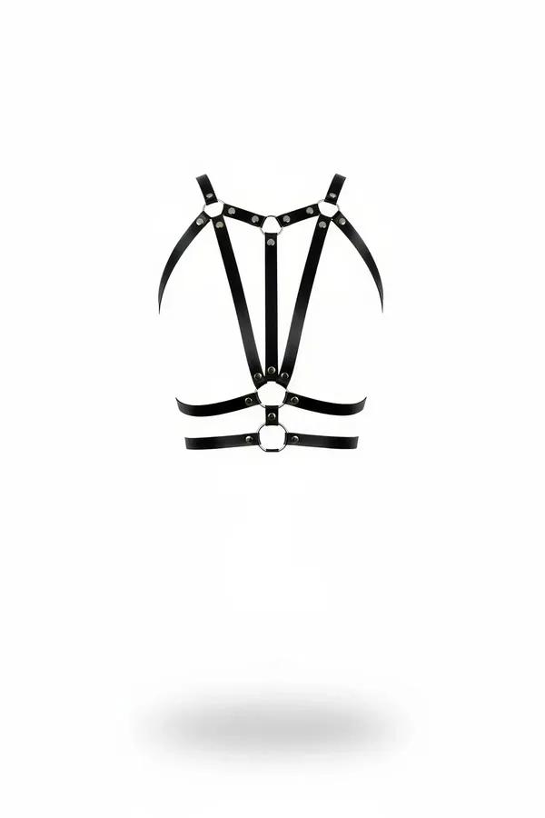 Black faux leather multi-strap chest harness with dual silver O-rings and rivet hardware on white background