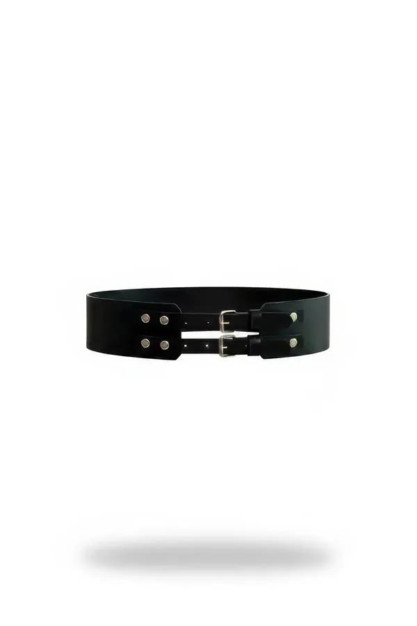 black faux leather wide waist cincher with two stacked silver pin buckles and rivet accents on white background