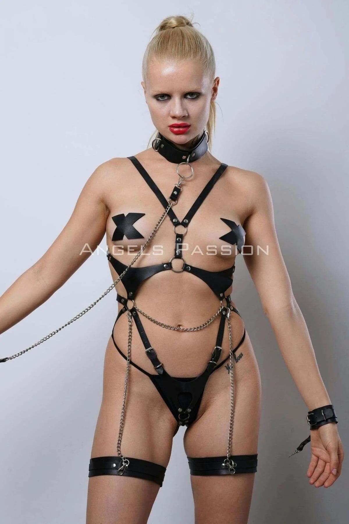 Black leather wrist cuffs with double-snap silver buckle hardware from body harness set