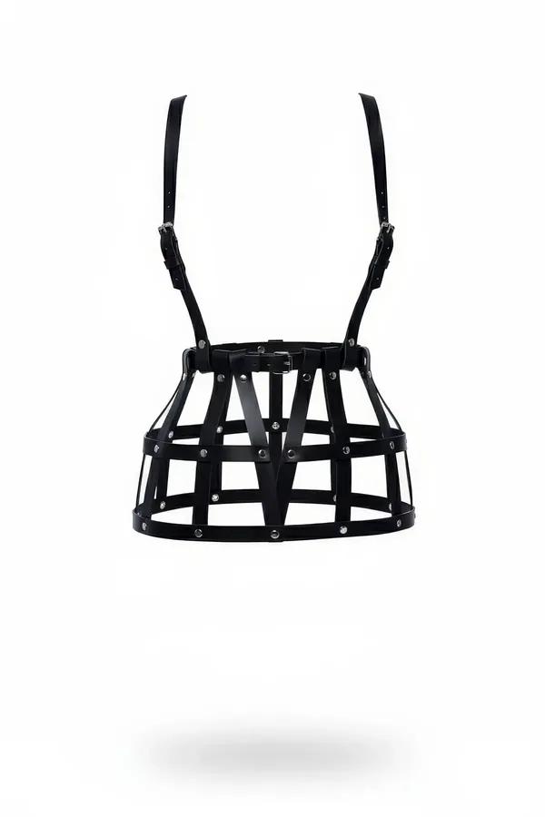 Black faux leather caged skirt harness with silver rivets and adjustable shoulder straps on white background