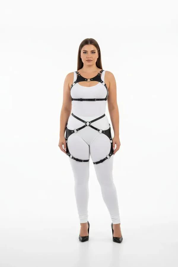 black faux leather full body harness with X-cross waist straps and silver O-ring thigh garters on model