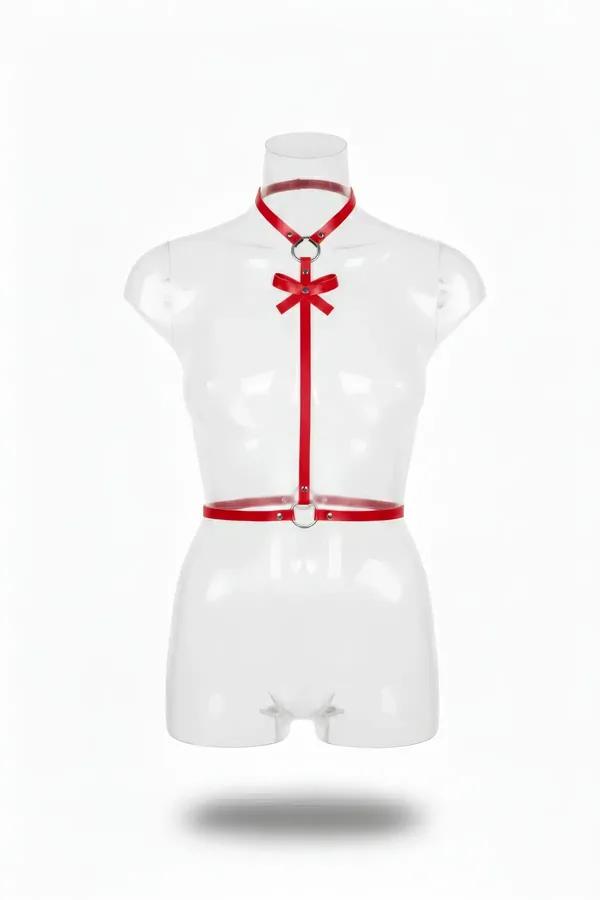Red faux leather choker body harness with decorative satin bow and silver O-ring hardware on a mannequin