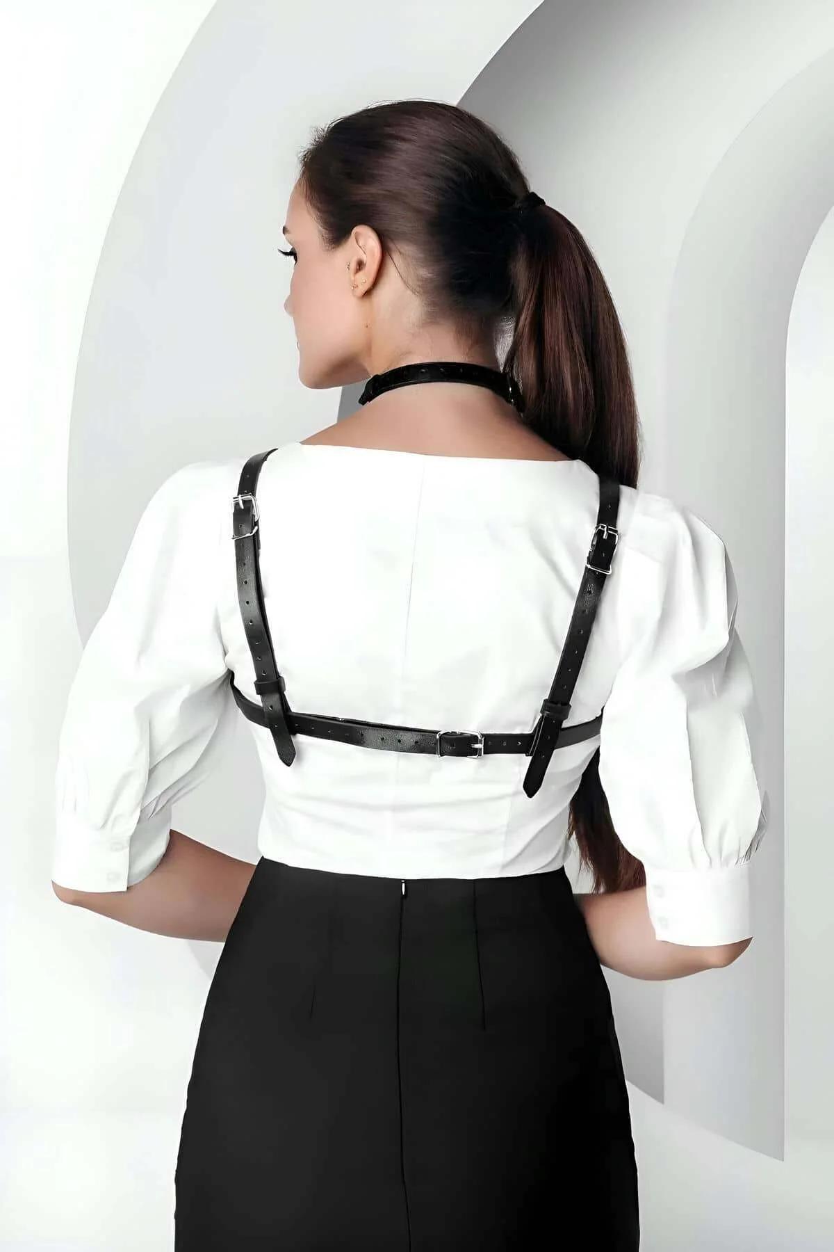 Matte black PU chest harness showing X-cross strap pattern and fixed neck loop detail