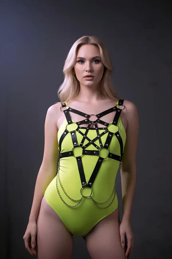 Black faux leather star cage body harness with silver O-rings and draped waist chains front view