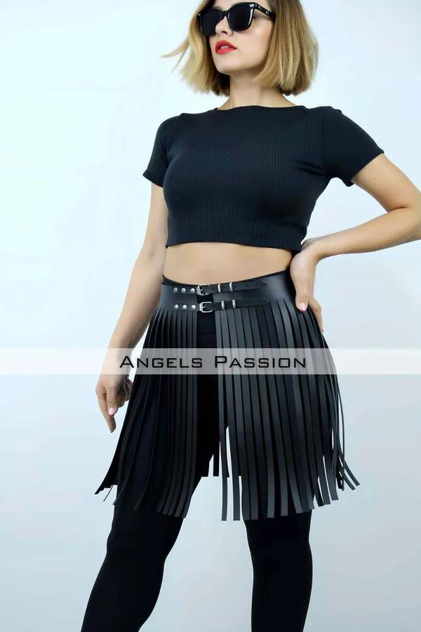 Black faux leather fringe waist overlay with double silver studded buckle belts worn over black leggings