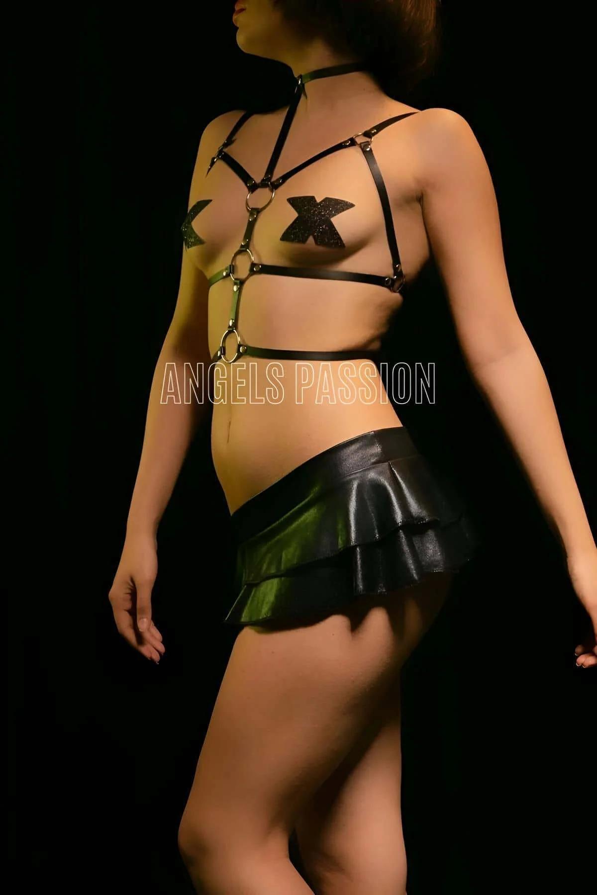 matte black PU leather chest harness showing triple O-ring vertical column and adjustable shoulder straps
