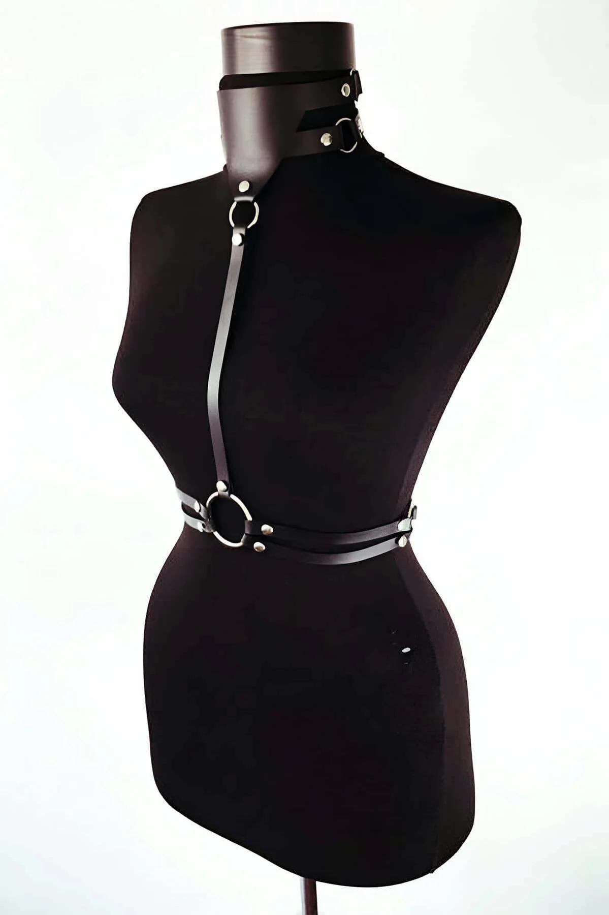 Close-up of wide black faux leather collar band with silver stud rivets and adjustable buckle closure
