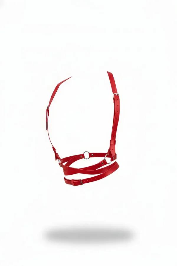 Red faux leather chest harness with silver O-ring center and adjustable multi-buckle straps on white background