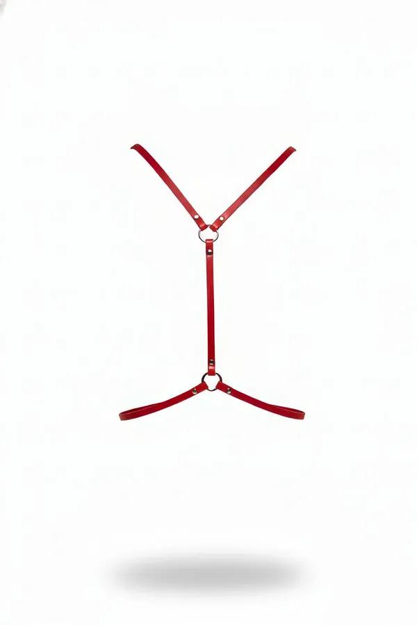 Red faux leather body harness with silver O-ring connectors, Y-chest strap and diagonal hip bands, white background