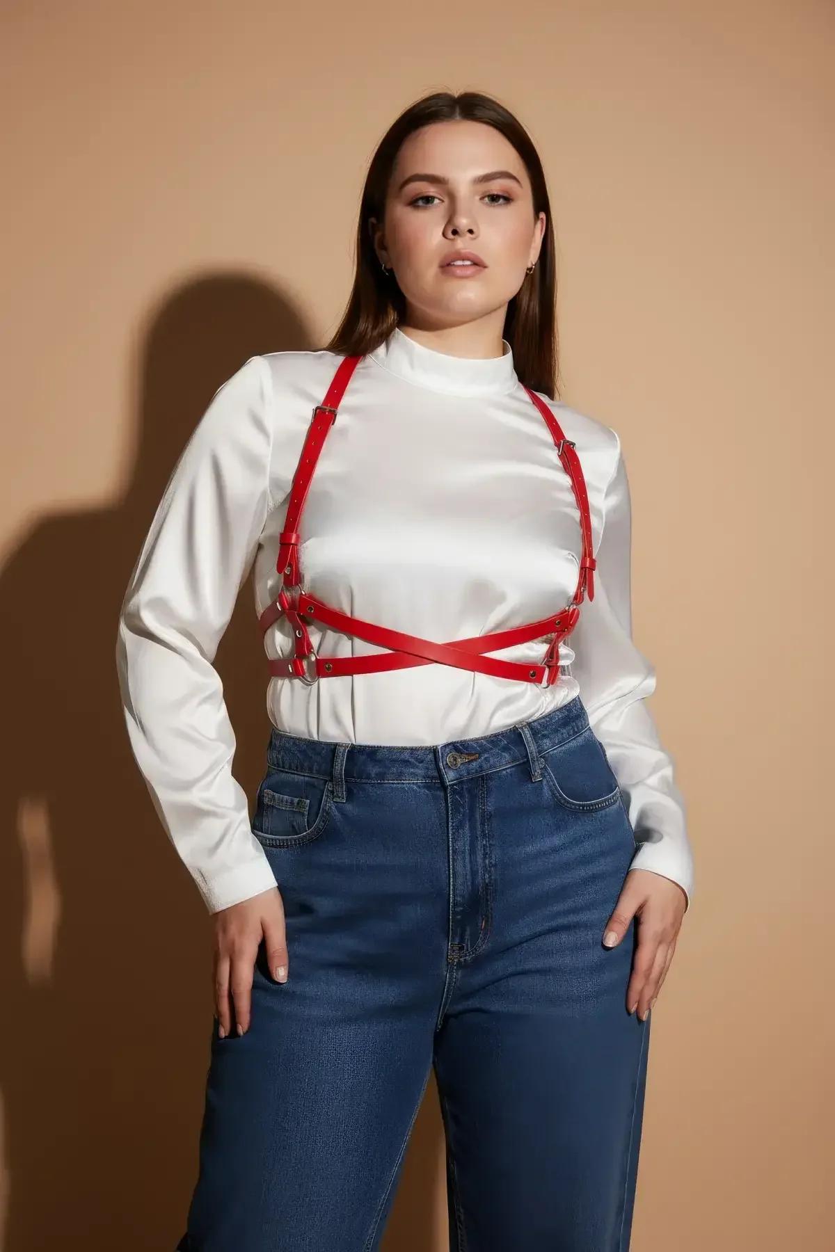 Front view of red faux leather body harness showing full X-cross strap configuration and buckle adjusters
