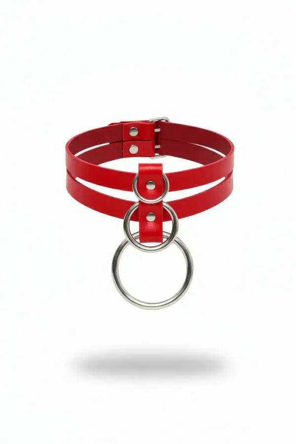 Red faux leather double strap choker with stacked silver O-rings and rivet hardware, white background