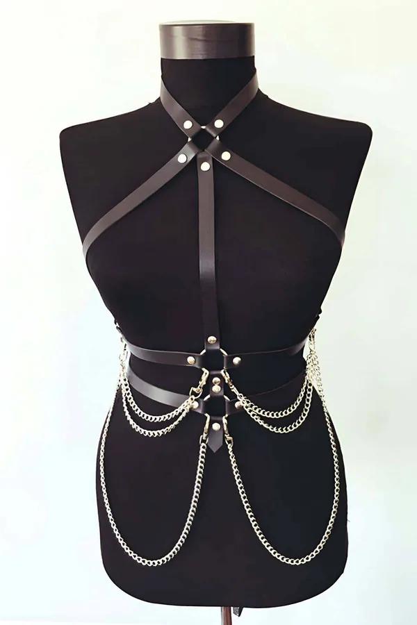 Black faux leather strappy body harness with three cascading gold-tone chain rows draped across the waist on a mannequin