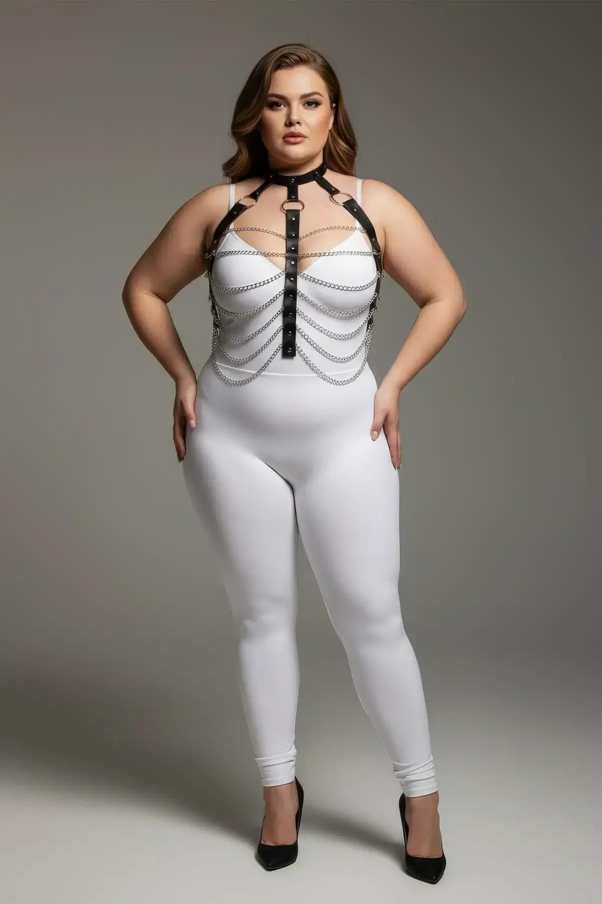 close-up of silver-tone rivet stud panel and cascading chain rows on black faux leather chest harness