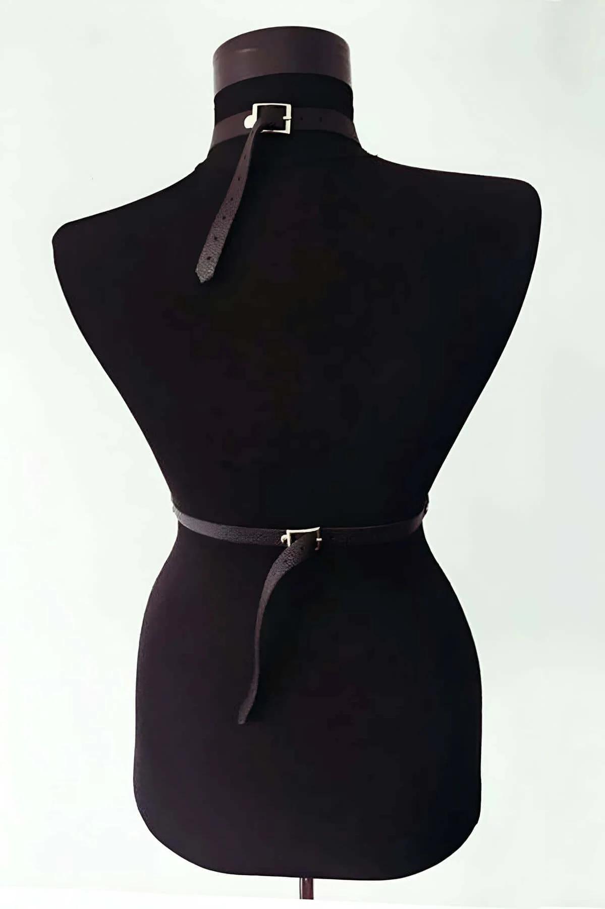 Asymmetric single neck strap detail of black faux leather body harness with buckle closure