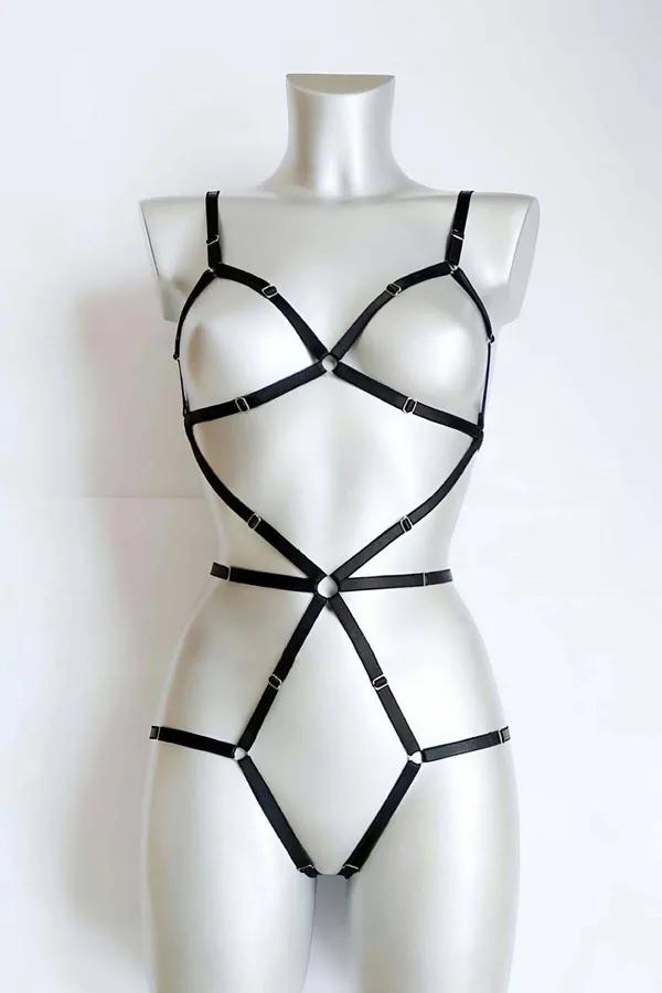 Black faux leather full body harness with two silver O-ring accents at chest and waist on mannequin