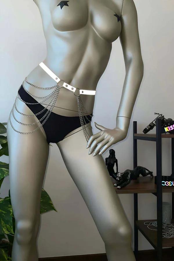 White reflective chain waist harness with silver D-rings and layered draping chains worn at natural waist