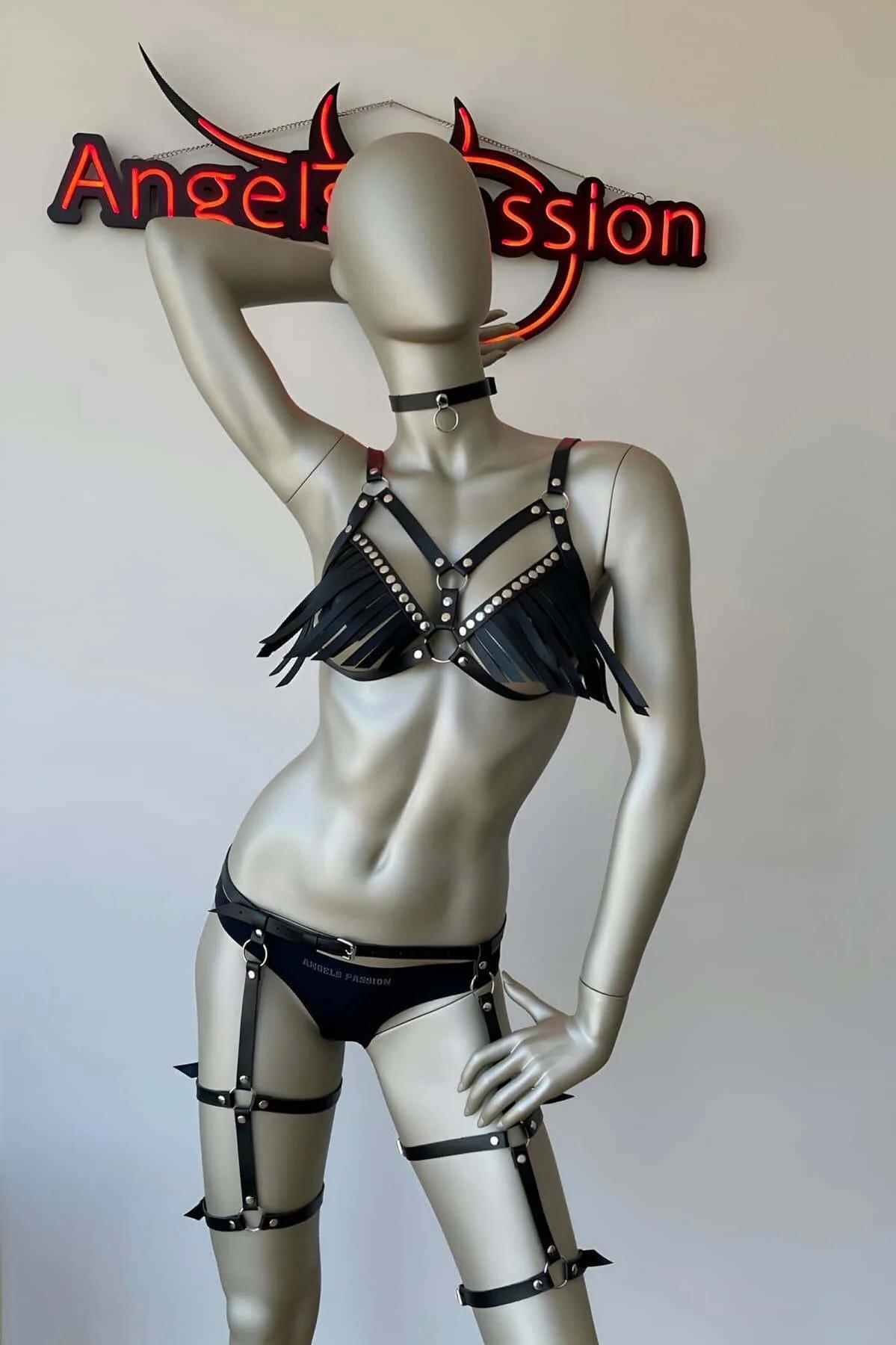 full body view of black faux leather fringe harness set with waist belt and thigh garters