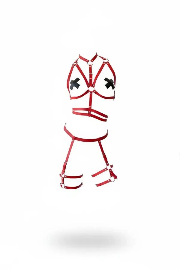 red faux leather chest harness set with X-strap bust O-ring hardware double waist belt and thigh garters on white background