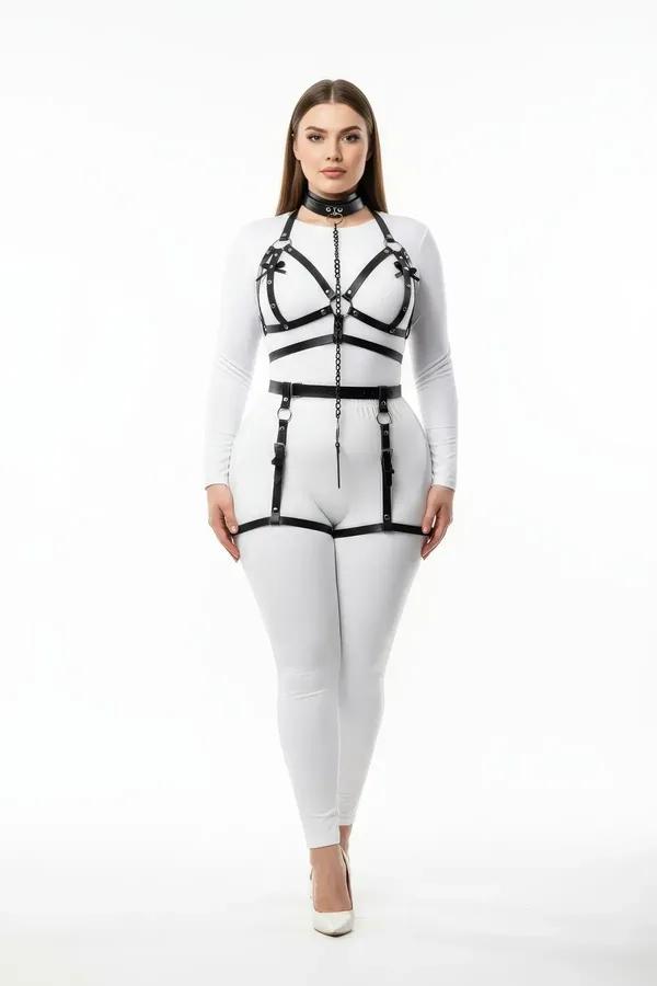 Black faux leather full body harness set with chain-linked choker, chest cage, waist belt, and thigh garters on model