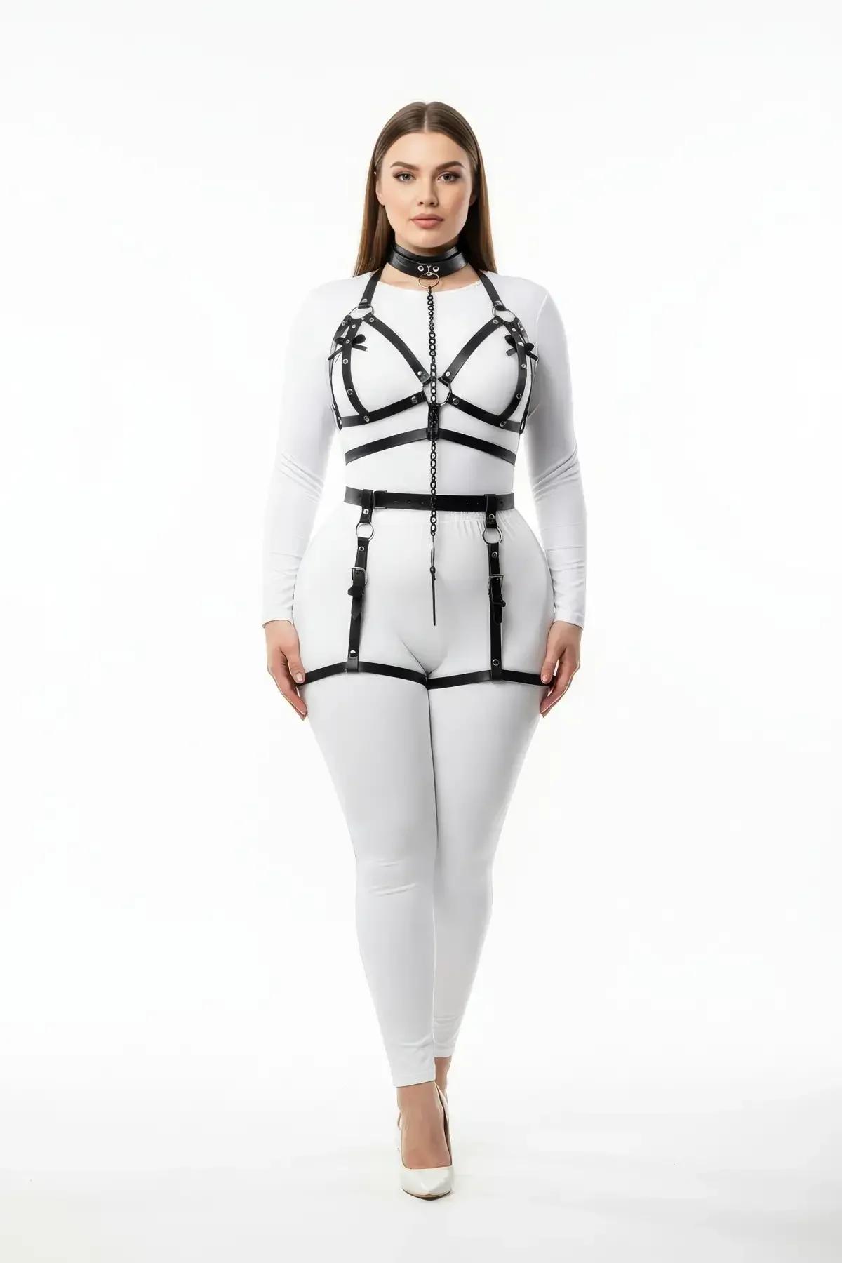 Black faux leather full body harness set with chain-linked choker, chest cage, waist belt, and thigh garters on model