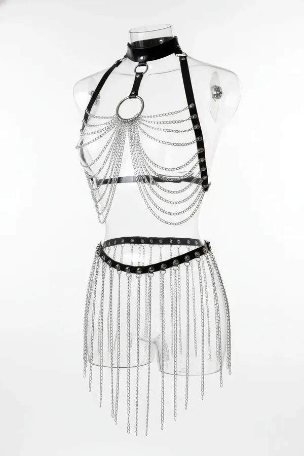 Black faux leather body harness with silver O-ring and cascading chain drape, paired with matching silver chain fringe skirt 