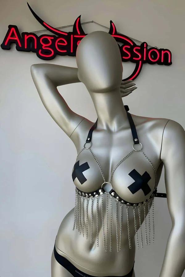 black vegan leather bra harness with silver chain fringe hanging from studded band and O-rings on mannequin