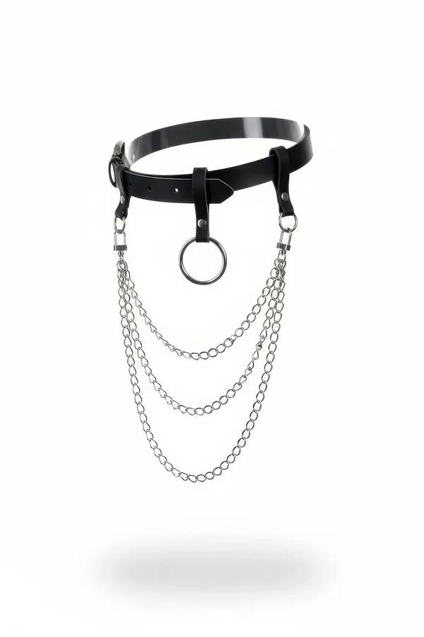 Black glossy faux leather waist harness with central silver O-ring and three cascading silver chains, front view on white bac