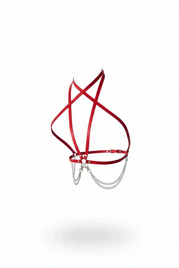 Red faux leather strappy harness with crossed chest straps and dual draped silver chains at front center