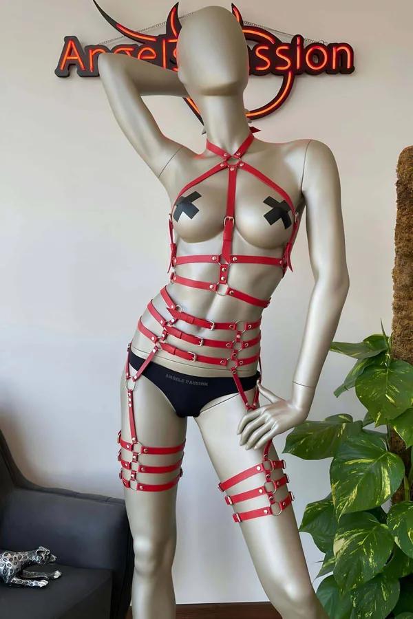 Red faux leather multi-strap full body harness with stacked thigh garters and silver O-ring buckle hardware on mannequin