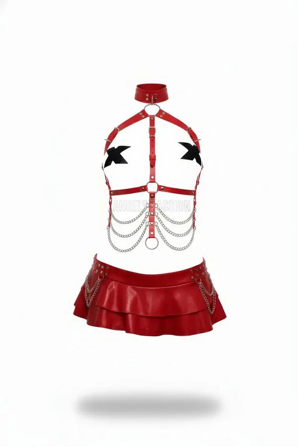 Red faux leather body harness with silver O-rings and cascading chains paired with double-tiered mini skirt and studded waist