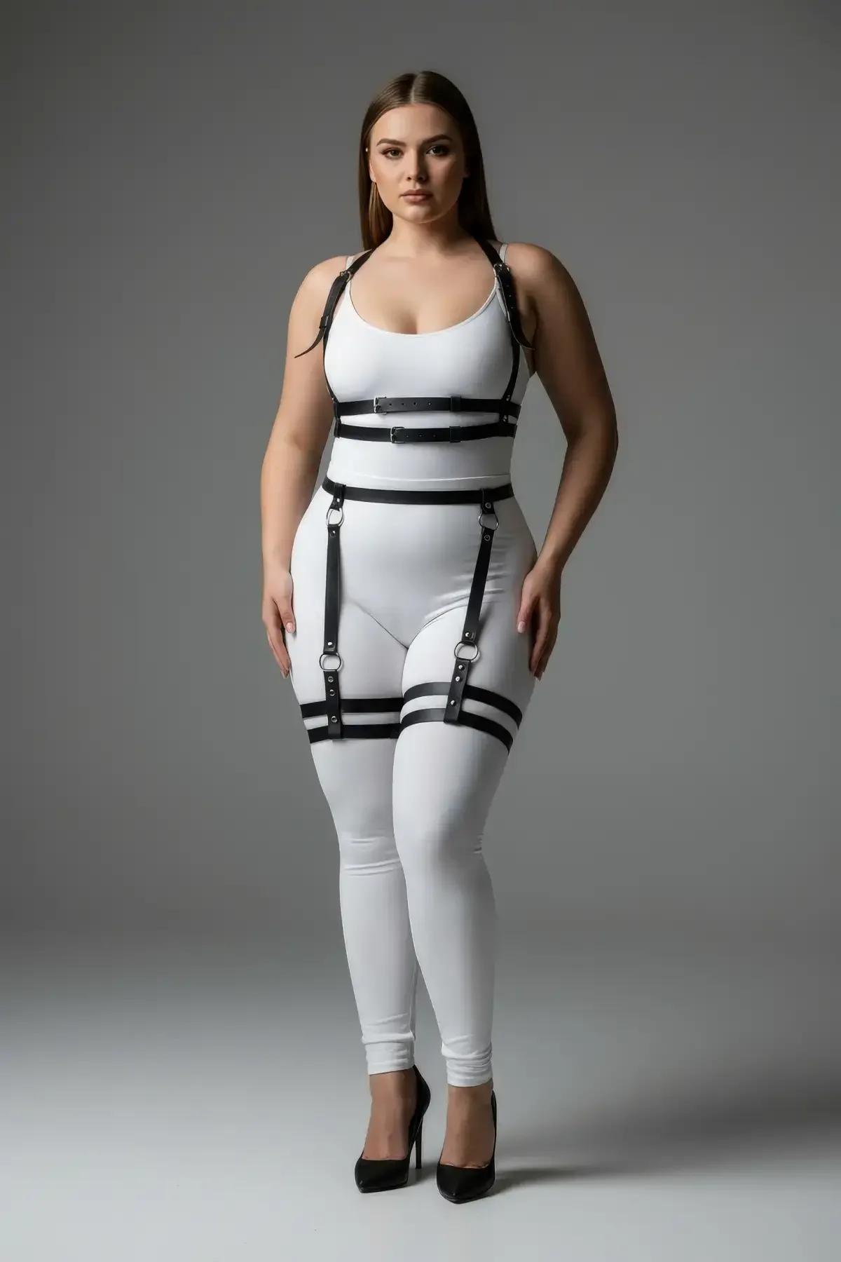 Close-up of black faux leather double chest band straps with silver-tone slide buckles on torso