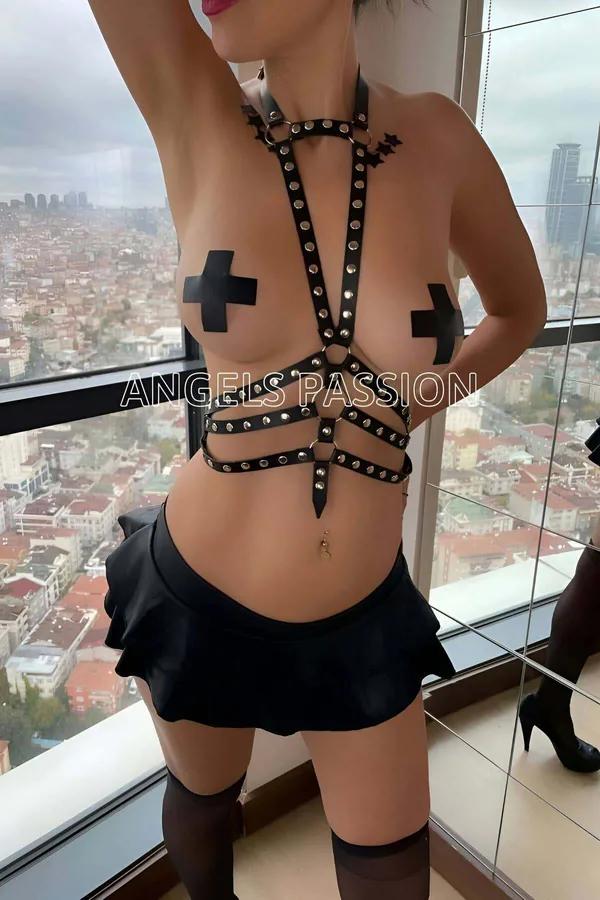 Black faux leather full body harness with silver dome studs, collar strap, and three-band cage waist section