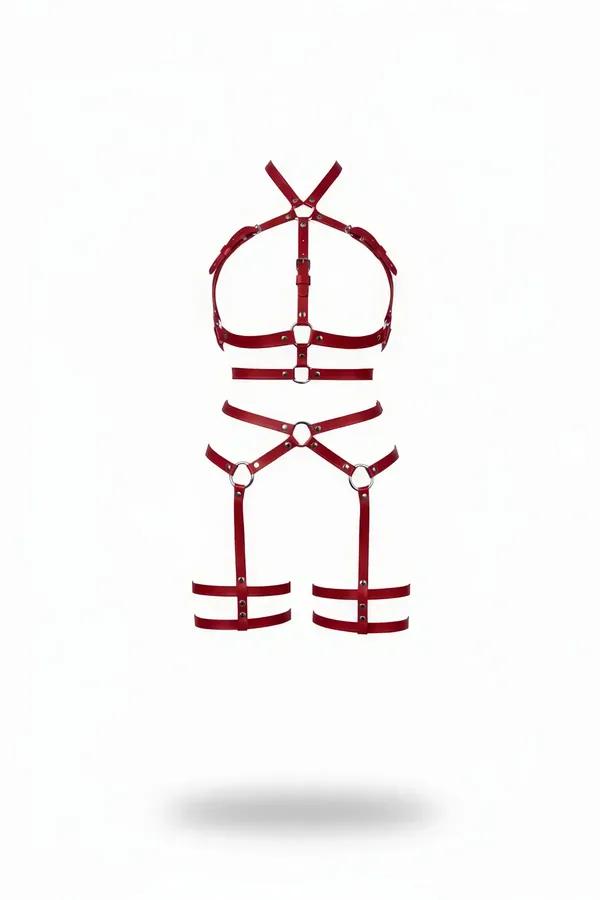 red faux leather chest harness and leg garter set with silver O-rings on white background