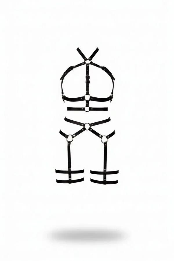 Black faux leather chest harness and thigh garter set with silver O-rings and stud-pin buckles, full body view