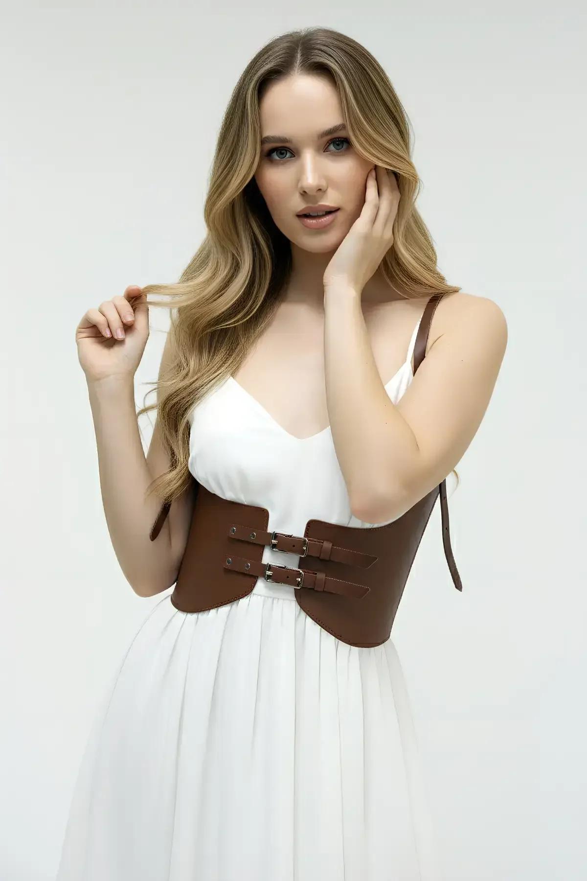 brown structured wide waist harness with adjustable shoulder straps front view