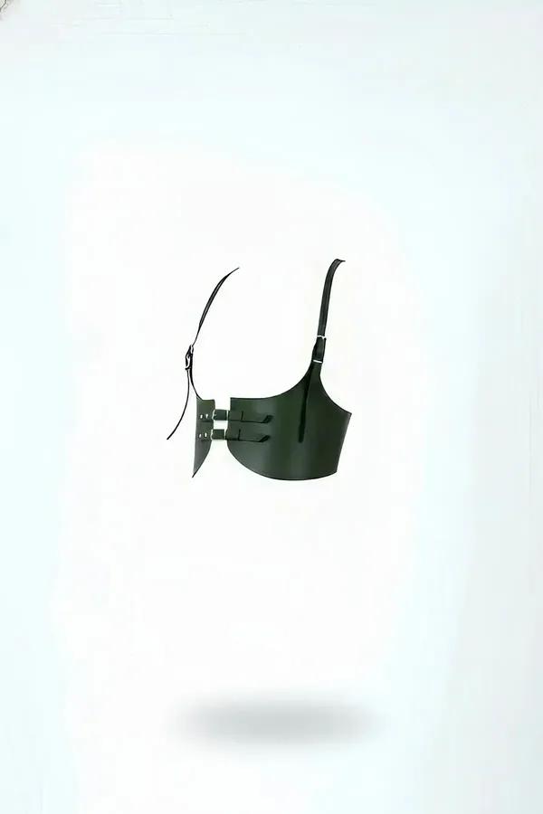 Dark olive faux leather underbust harness with double silver front buckles and adjustable shoulder strap, side angle view