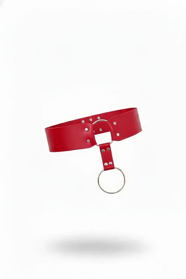 Red faux leather wide waist belt with front-drop silver O-ring and rivet studs on white background