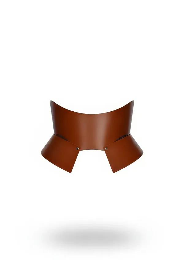 Structured tan faux leather waist cinch harness with flared architectural panels and silver rivet hardware detail