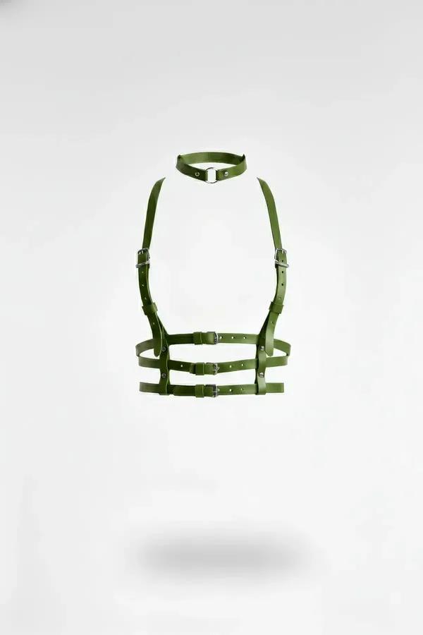 Olive green faux leather underbust harness with matching choker and six silver-tone buckles, floating studio shot