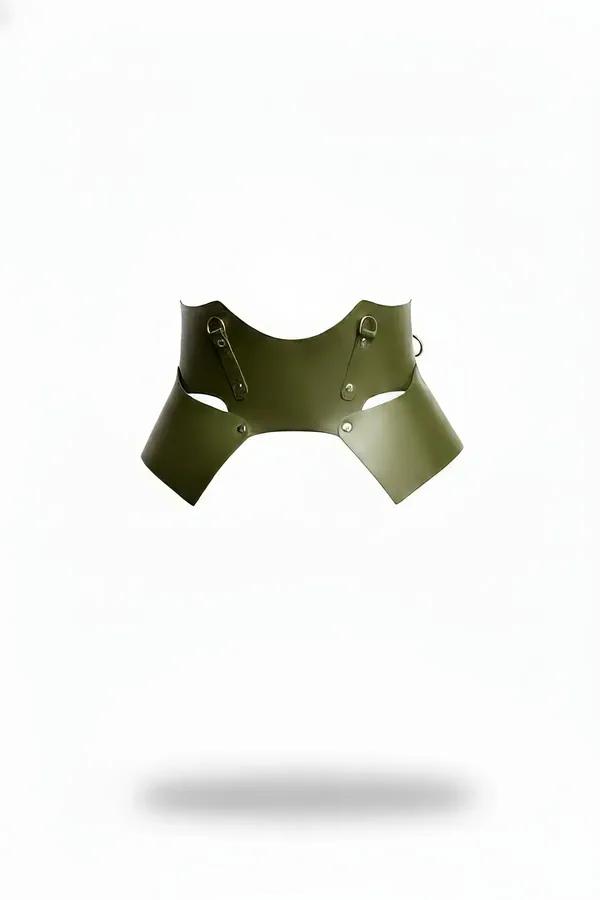 Olive green structured faux leather waist harness with four silver D-rings and architectural side cutouts, matte finish