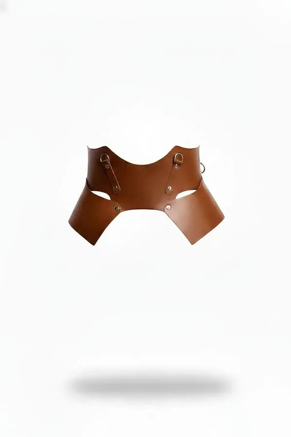 Structured tan faux leather underbust waist cinch harness with brass D-rings and curved side cutouts