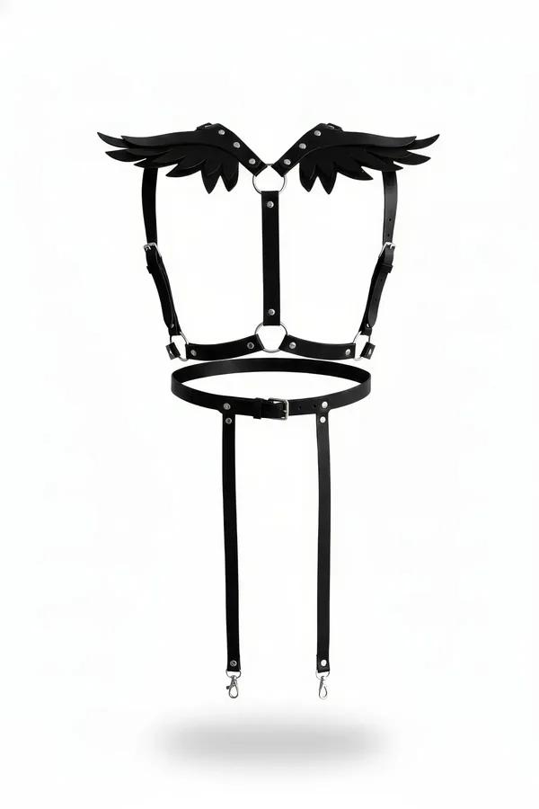 Black faux leather winged shoulder harness with silver O-rings and two detachable garter straps, flat lay on white background