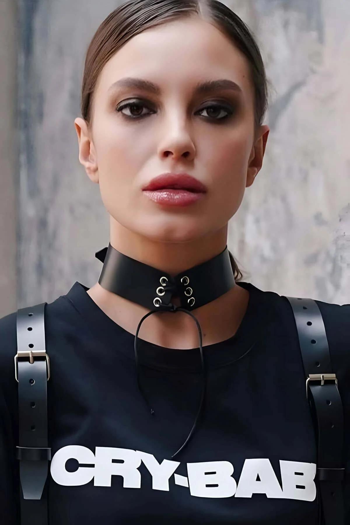 Close-up of black matte PU choker front panel showing three silver lace-through rings and center-front detail